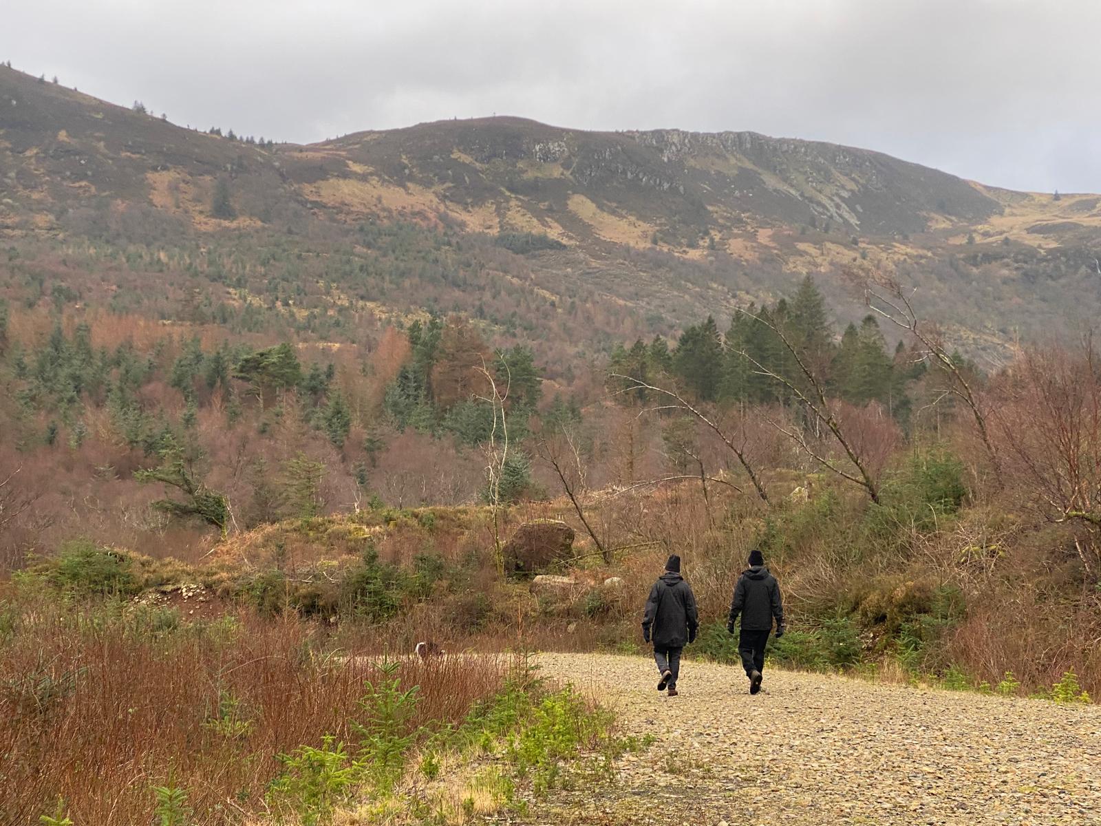 Two people walking through the hills on Arran