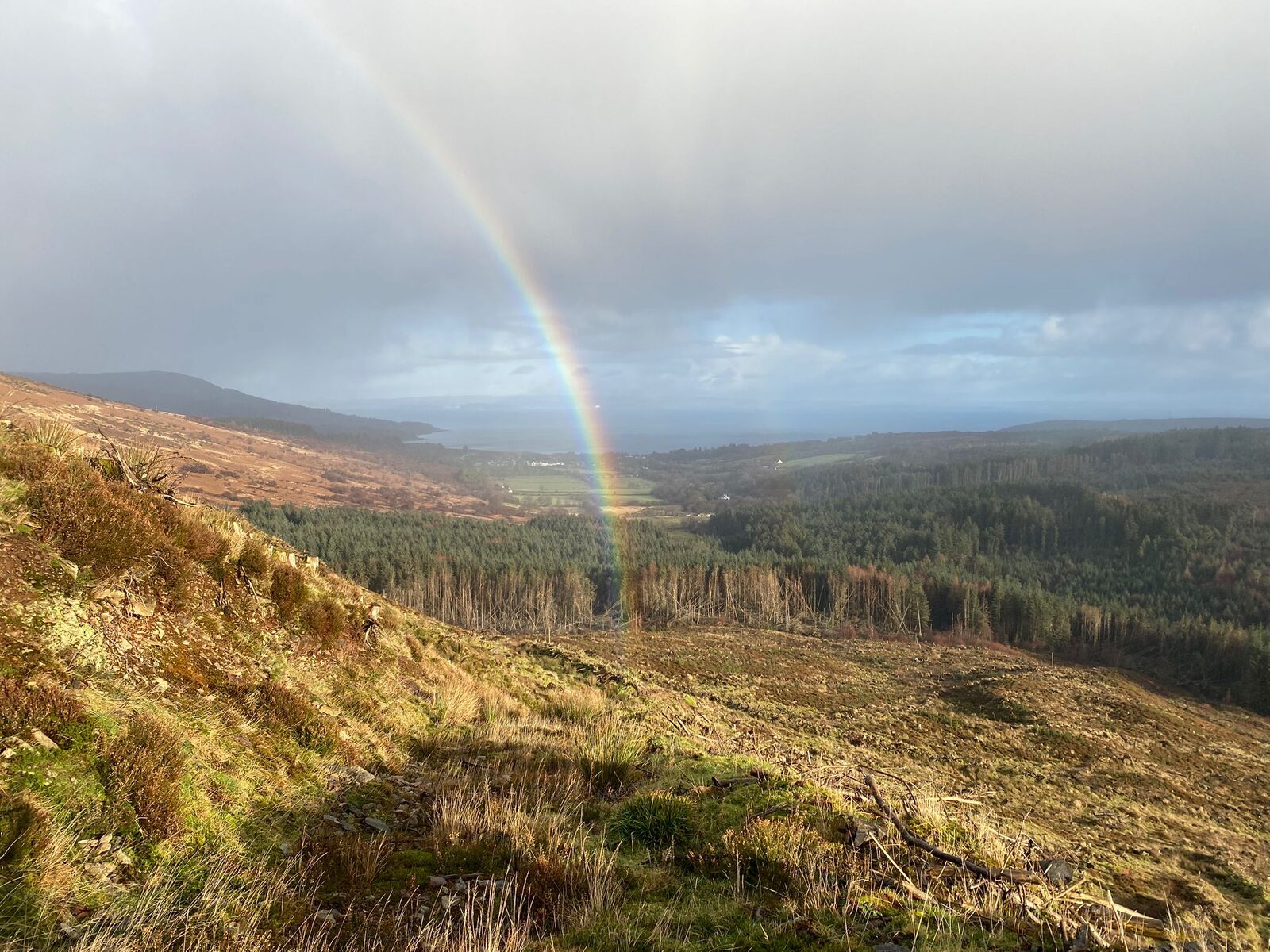 A rainbow over the hills and coast of Arran